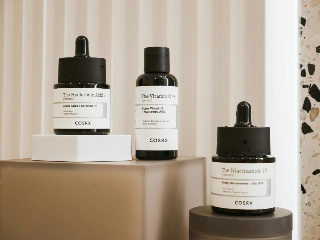 Bí Quyết Sở Hữu Làn Da "Glass Skin" Vạn Người Mê Cùng Mỹ Phẩm Luneria Elegant display of COSRX skincare bottles on a modern backdrop. Perfect for beauty and wellness content.